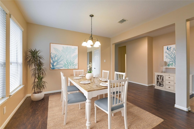 18015 Secret Branch Ln, Cypress, TX 77433 - dining space featuring wood finished floors, baseboards, and a chandelier