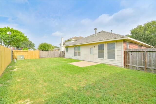 18015 Secret Branch Ln, Cypress, TX 77433 - rear view of property featuring a patio area and a shingled roof