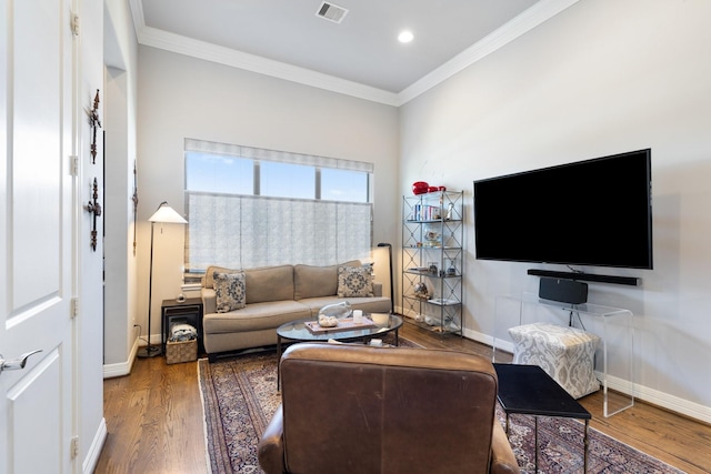 308 W Saulnier St, Houston, TX 77019 - living area featuring recessed lighting, ornamental molding, baseboards, visible vents, and wood finished floors