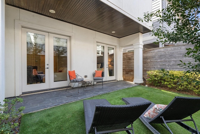 308 W Saulnier St, Houston, TX 77019 - view of patio featuring fence and french doors