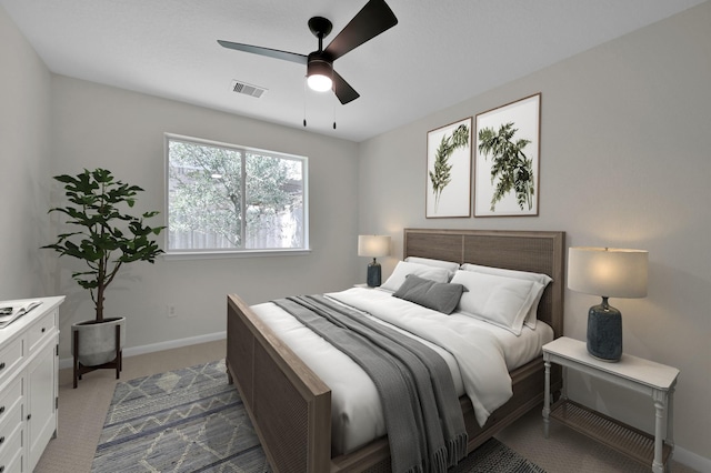 82 S Regan Mead Cir, Montgomery, TX 77382 - bedroom with baseboards, dark carpet, and ceiling fan