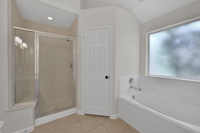 82 S Regan Mead Cir, Montgomery, TX 77382 - bathroom with a shower stall, tile patterned floors, a bath, and baseboards