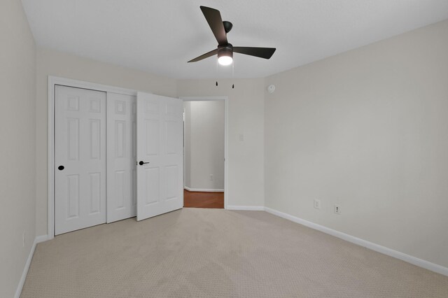 82 S Regan Mead Cir, Montgomery, TX 77382 - unfurnished bedroom featuring carpet, baseboards, a closet, and a ceiling fan