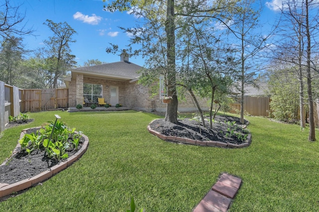 82 S Regan Mead Cir, Montgomery, TX 77382 - view of front facade with a chimney, brick siding, and roof with shingles