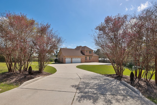 8536 Prince William Ct, Montgomery, TX 77316 - traditional home with driveway, a front lawn, brick siding, and a garage
