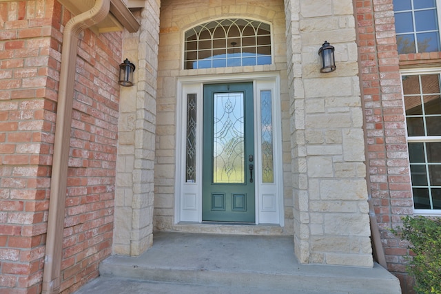 8536 Prince William Ct, Montgomery, TX 77316 - view of exterior entry with brick siding, stone siding, and covered porch
