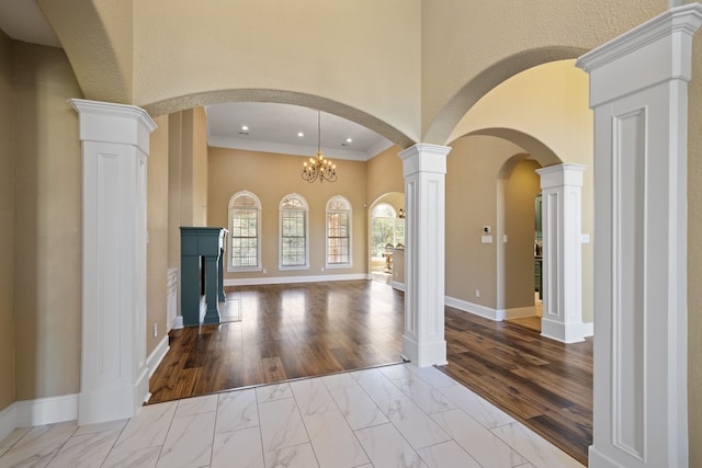 8536 Prince William Ct, Montgomery, TX 77316 - foyer featuring marble look tile flooring, crown molding, baseboards, recessed lighting, and arched walkways