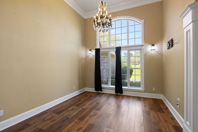 8536 Prince William Ct, Montgomery, TX 77316 - foyer entrance featuring a chandelier, ornamental molding, dark wood finished floors, plenty of natural light, and baseboards