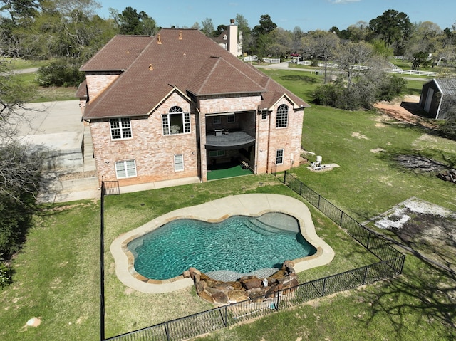 8536 Prince William Ct, Montgomery, TX 77316 - back of property with brick siding, a chimney, roof with shingles, and a patio area