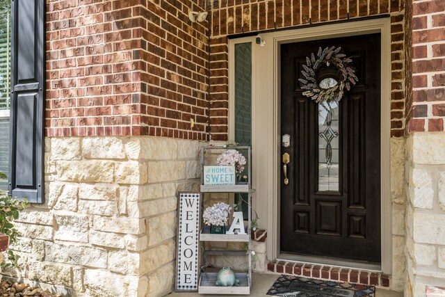 17823 Dappled Walk Way, Cypress, TX 77429 - property entrance featuring brick siding, a porch, and stone siding
