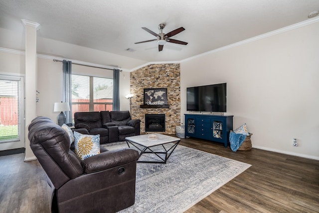 living room with wood finished floors, crown molding, baseboards, and ceiling fan