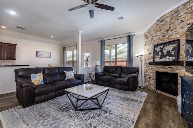 living area featuring visible vents, ornamental molding, and dark wood-style flooring