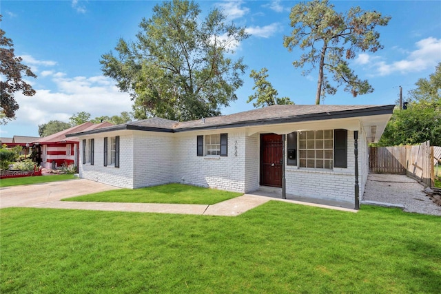 ranch-style house with brick siding, driveway, a front yard, and fence