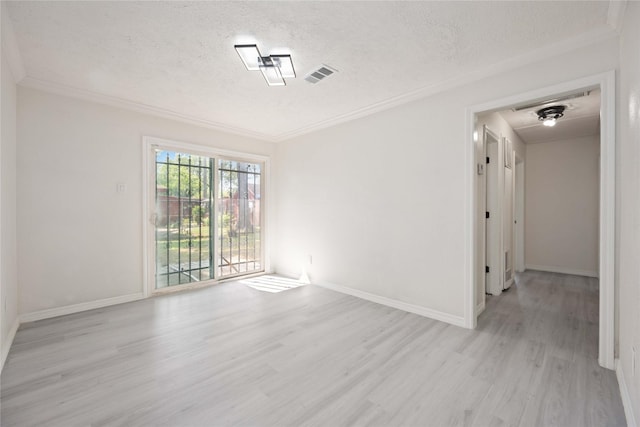 unfurnished room featuring ornamental molding, baseboards, light wood finished floors, and a textured ceiling