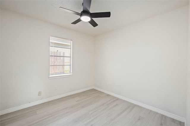 unfurnished room featuring baseboards, ceiling fan, and light wood finished floors
