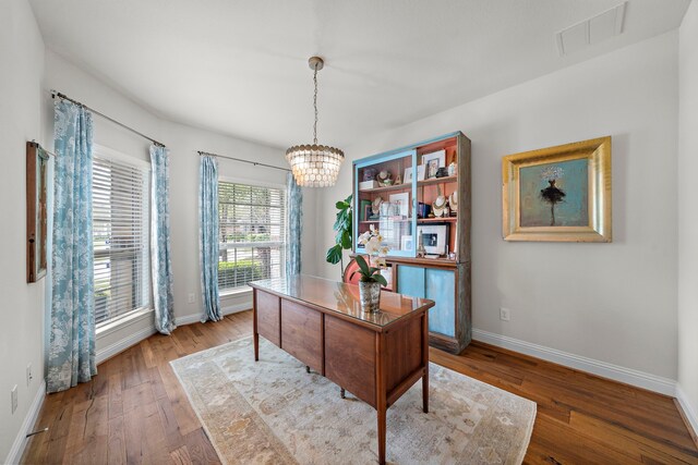 4738 Trickle Creek Ct, Fulshear, TX 77441 - office featuring a chandelier, baseboards, and wood finished floors