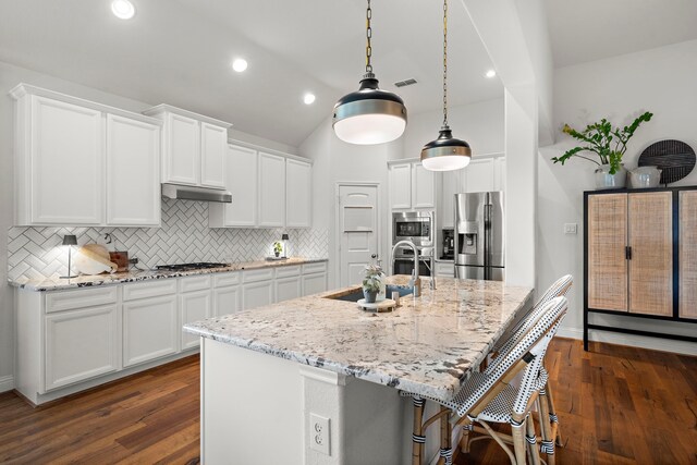 4738 Trickle Creek Ct, Fulshear, TX 77441 - kitchen featuring stainless steel appliances, a sink, decorative backsplash, white cabinetry, and dark wood finished floors