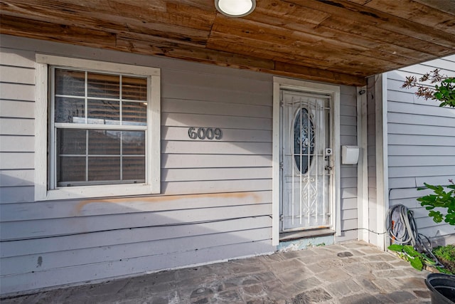 6009 Crane St, Houston, TX 77026 - doorway to property featuring a porch