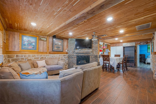 6009 Crane St, Houston, TX 77026 - living area featuring visible vents, a ceiling fan, hardwood / wood-style floors, wooden ceiling, and a fireplace