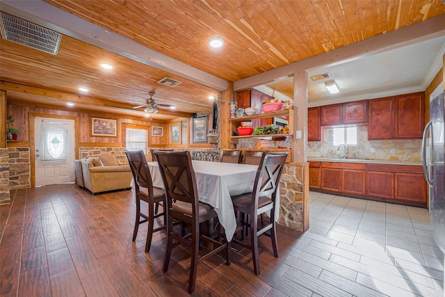 6009 Crane St, Houston, TX 77026 - dining space featuring light wood-style floors, visible vents, and wood ceiling