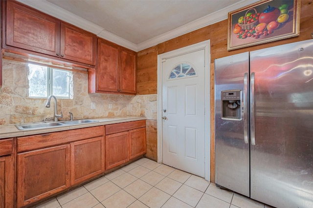 6009 Crane St, Houston, TX 77026 - kitchen featuring light tile patterned floors, stainless steel refrigerator with ice dispenser, a sink, and light countertops