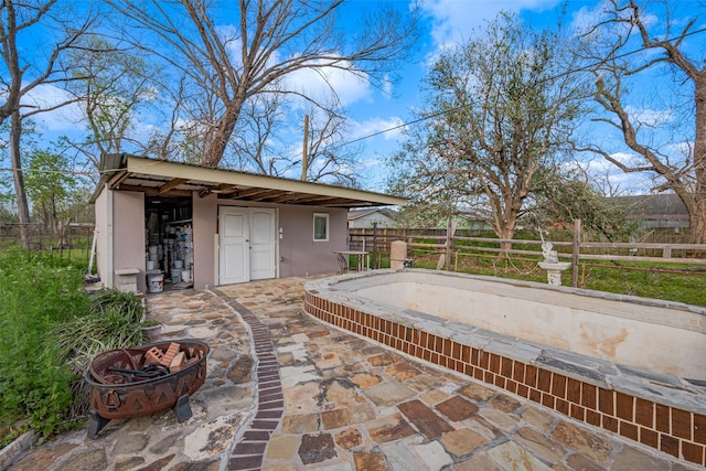 6009 Crane St, Houston, TX 77026 - view of patio / terrace with fence and an outdoor structure