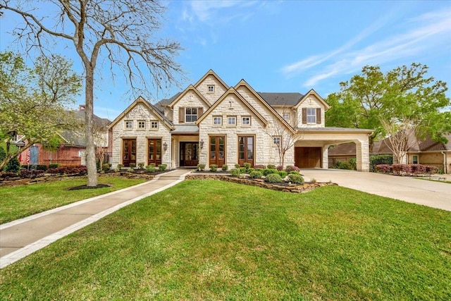 2023 Greenwood Oaks Dr, Houston, TX 77062 - view of front of home with a front lawn, concrete driveway, and stone siding