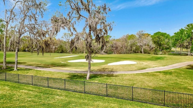 2023 Greenwood Oaks Dr, Houston, TX 77062 - view of community with a lawn, view of golf course, and fence