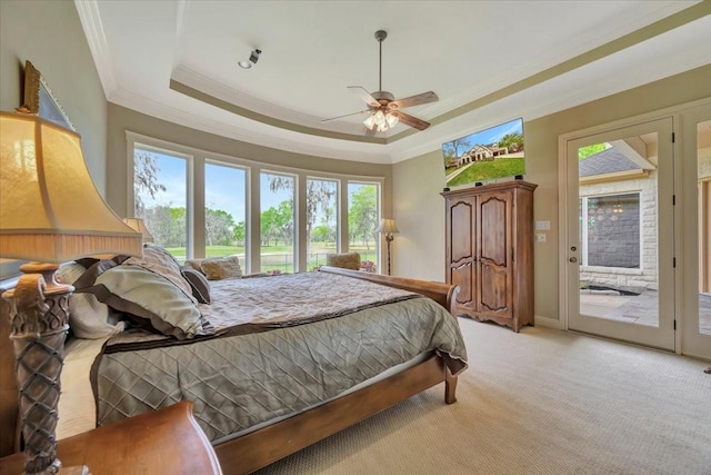 2023 Greenwood Oaks Dr, Houston, TX 77062 - bedroom with access to exterior, ceiling fan, a tray ceiling, ornamental molding, and light carpet