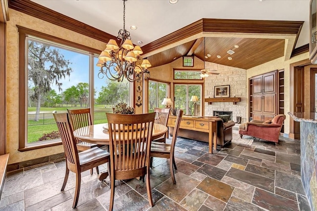 2023 Greenwood Oaks Dr, Houston, TX 77062 - dining space featuring stone tile floors, recessed lighting, a stone fireplace, vaulted ceiling, and ceiling fan with notable chandelier