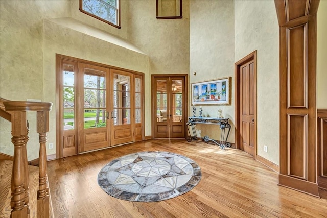 2023 Greenwood Oaks Dr, Houston, TX 77062 - foyer featuring light wood-style flooring, french doors, and a healthy amount of sunlight