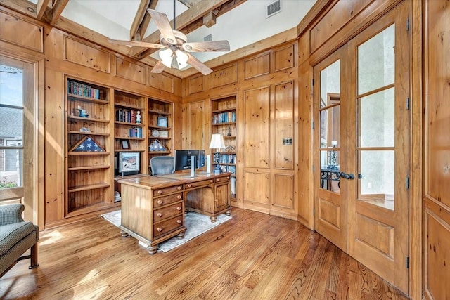 2023 Greenwood Oaks Dr, Houston, TX 77062 - office with visible vents, wooden walls, and light wood finished floors