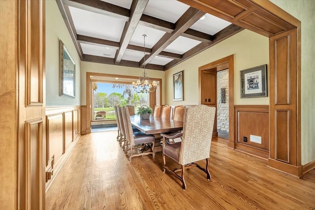 2023 Greenwood Oaks Dr, Houston, TX 77062 - dining space with an inviting chandelier, light wood-style flooring, coffered ceiling, and beam ceiling