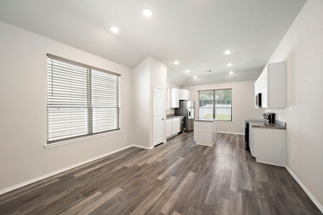 5899 Skylane Dr, Montgomery, TX 77316 - kitchen featuring appliances with stainless steel finishes, dark wood-style flooring, white cabinetry, recessed lighting, and baseboards