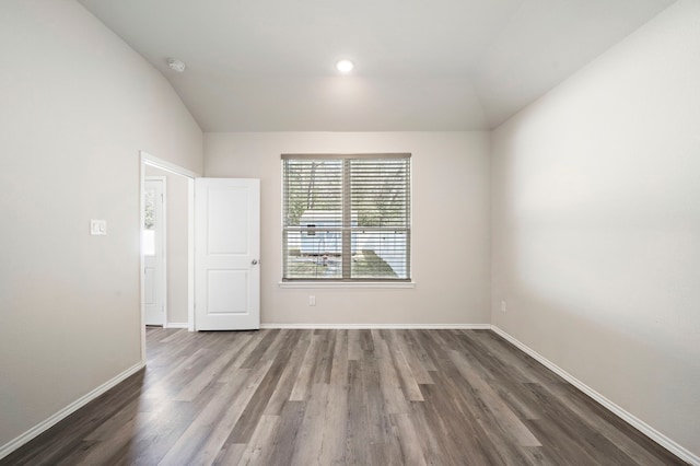 5899 Skylane Dr, Montgomery, TX 77316 - unfurnished room with vaulted ceiling, dark wood-style floors, baseboards, a smoke detector, and recessed lighting