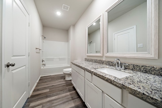 5899 Skylane Dr, Montgomery, TX 77316 - bathroom featuring toilet, wood finished floors, vanity, shower / bath combination, and recessed lighting