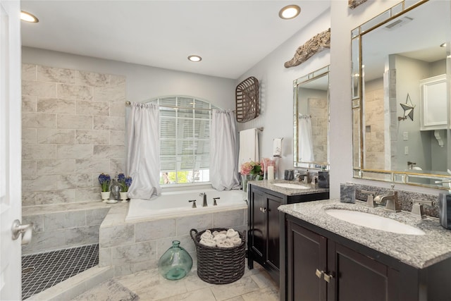 834 Lamonte Ln, Houston, TX 77018 - bathroom featuring a sink, visible vents, a bath, and recessed lighting