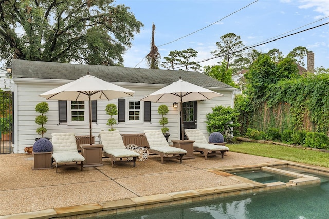 834 Lamonte Ln, Houston, TX 77018 - rear view of property featuring roof with shingles, a patio area, an in ground hot tub, and fence