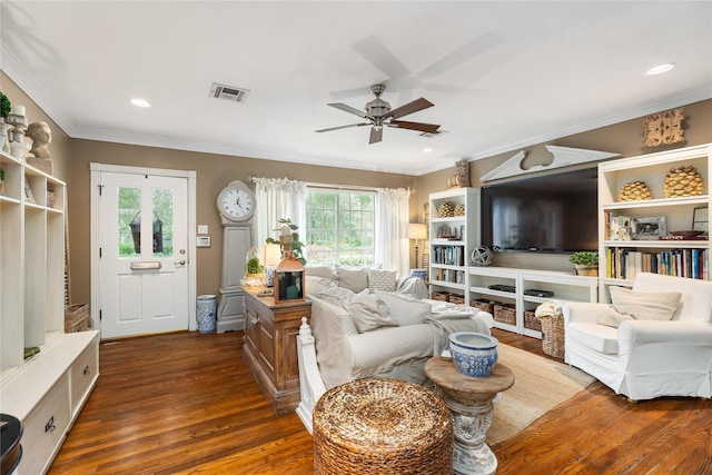 834 Lamonte Ln, Houston, TX 77018 - living room featuring ornamental molding, visible vents, ceiling fan, and dark wood finished floors