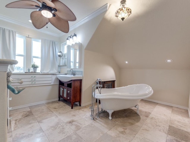 bathroom with vanity, baseboards, a soaking tub, ceiling fan, and crown molding