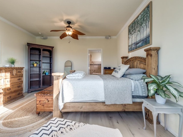 bedroom featuring connected bathroom, light wood-type flooring, a ceiling fan, and ornamental molding