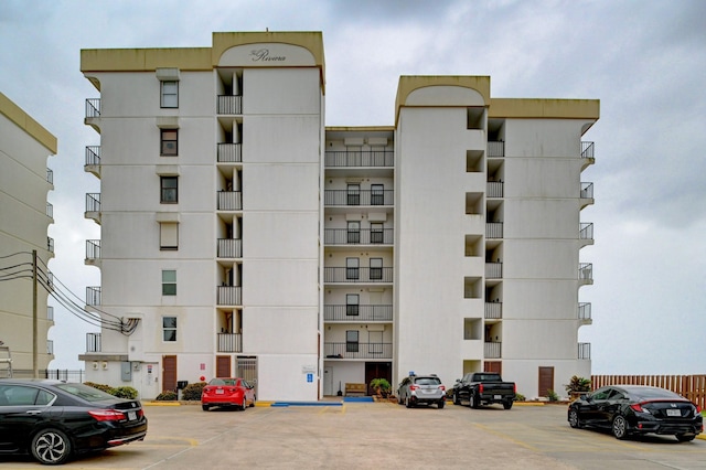 view of property with uncovered parking