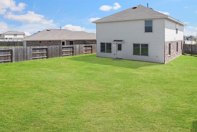 14407 Woodcott Warren Way, Rosharon, TX 77583 - rear view of house featuring roof with shingles