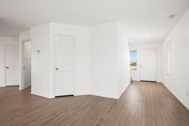 14407 Woodcott Warren Way, Rosharon, TX 77583 - empty room with wood finished floors, baseboards, and a smoke detector