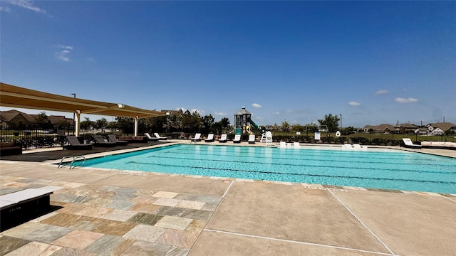 14407 Woodcott Warren Way, Rosharon, TX 77583 - community pool featuring a patio