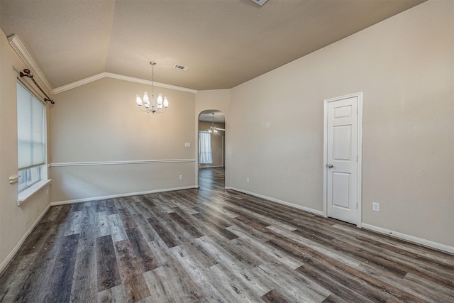 unfurnished room featuring an inviting chandelier, arched walkways, baseboards, wood finished floors, and visible vents