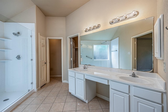 full bathroom with a sink, tile patterned floors, and a shower stall