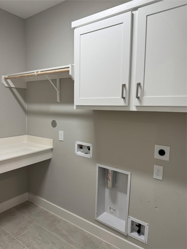 16040 Mason Run Dr, Houston, TX 77079 - laundry room with electric dryer hookup, hookup for a washing machine, cabinet space, and light tile patterned flooring