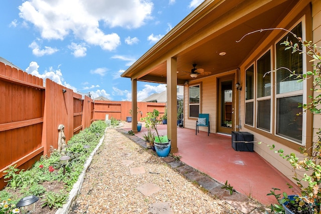 view of patio featuring a ceiling fan and a fenced backyard