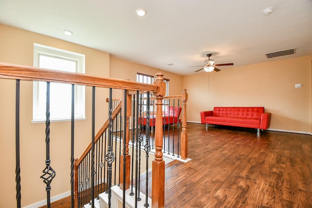 interior space with baseboards, visible vents, recessed lighting, wood finished floors, and ceiling fan